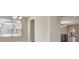 Bright living room with view of the kitchen and large window at 11807 Charades St, Orlando, FL 32832
