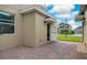 Brick patio with an open door and view of the neighborhood at 11807 Charades St, Orlando, FL 32832