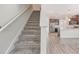 Carpeted staircase leading to the home's upper level at 11807 Charades St, Orlando, FL 32832