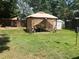 Backyard with a gazebo and outdoor seating area for relaxing or entertaining, perfect for enjoying the outdoors at 1203 Monterey Dr, Eustis, FL 32726