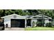 Charming single-story home with well-maintained lawn, decorative front door, and inviting curb appeal at 1203 Monterey Dr, Eustis, FL 32726