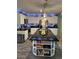 Modern kitchen with a large island, stainless steel appliances, and sleek countertops at 1203 Monterey Dr, Eustis, FL 32726