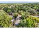 Beautiful blue home nestled among trees in a serene neighborhood with lush greenery at 1203 W 16Th St, Sanford, FL 32771