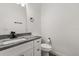 Modern bathroom with granite countertops, a white vanity, and tile flooring at 1203 W 16Th St, Sanford, FL 32771