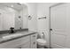 Bathroom featuring a marble countertop, modern fixtures, and a shower with marble tiling at 1203 W 16Th St, Sanford, FL 32771