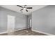 Bedroom featuring neutral walls, hardwood floors, and two closet spaces at 1203 W 16Th St, Sanford, FL 32771