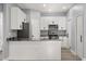 Modern kitchen with white cabinetry, stainless appliances, and granite countertops at 1203 W 16Th St, Sanford, FL 32771