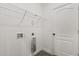 Storage closet featuring a white door, metal shelving, and hook ups at 1203 W 16Th St, Sanford, FL 32771