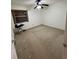 Bedroom with fan lighting, closet and carpeting, and window at 130 Jasmine Woods Ct # 3D, Deltona, FL 32725