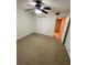 Bedroom with fan lighting, closet and carpeting at 130 Jasmine Woods Ct # 3D, Deltona, FL 32725