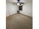 Bedroom with fan lighting, closet and carpeting, and small window at 130 Jasmine Woods Ct # 3D, Deltona, FL 32725