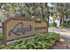 Community sign for Lakonia Condominiums with lush landscaping at 130 Jasmine Woods Ct # 3D, Deltona, FL 32725