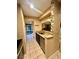 Kitchen area showcasing granite countertops, stainless steel dishwasher, and tiled floors at 130 Jasmine Woods Ct # 3D, Deltona, FL 32725