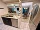 Kitchen view that highlights granite countertops and stainless steel appliances with an open dining space concept at 130 Jasmine Woods Ct # 3D, Deltona, FL 32725