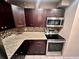 Kitchen featuring stainless steel appliances, granite countertops and mosaic backsplash at 130 Jasmine Woods Ct # 3D, Deltona, FL 32725