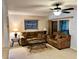 Comfortable living room with neutral colored furniture, rug, and ceiling fan at 130 Jasmine Woods Ct # 3D, Deltona, FL 32725