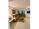 Cozy living room featuring sofas, stylish side tables, and access to a screened patio at 130 Jasmine Woods Ct # 3D, Deltona, FL 32725