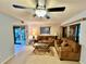 Comfortable living room featuring brown couches and a ceiling fan at 130 Jasmine Woods Ct # 3D, Deltona, FL 32725