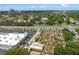 This aerial showcases the property, nearby road, lush green surroundings, and attractions like the captivating miniature golf at 13427 Blue Heron Beach Dr # 1907, Orlando, FL 32821