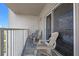 Enjoy the fresh air and relaxing view with comfortable seating on your private balcony, right off the rooms sliding glass door at 13427 Blue Heron Beach Dr # 1907, Orlando, FL 32821
