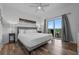 Relaxing bedroom featuring a comfortable bed, stylish decor, and private balcony access at 13427 Blue Heron Beach Dr # 1907, Orlando, FL 32821