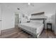 Bright and airy bedroom with modern decor and a glimpse into the luxurious en-suite bathroom at 13427 Blue Heron Beach Dr # 1907, Orlando, FL 32821