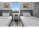 Cozy bedroom with two twin beds and a view at 13427 Blue Heron Beach Dr # 1907, Orlando, FL 32821