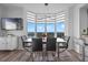 Stylish dining area with modern table, ample seating, and expansive windows offering panoramic views and easy access to amenities at 13427 Blue Heron Beach Dr # 1907, Orlando, FL 32821