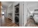 Hallway view with a bunk bed and laundry machines at 13427 Blue Heron Beach Dr # 1907, Orlando, FL 32821