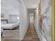 Hallway featuring art and lighting, with a bedroom visible to the side at 13427 Blue Heron Beach Dr # 1907, Orlando, FL 32821