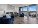Comfortable living room with modern seating, view, and sliding glass doors to the balcony at 13427 Blue Heron Beach Dr # 1907, Orlando, FL 32821