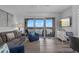 Inviting living room with a beautiful view, comfortable seating, and a sliding glass door at 13427 Blue Heron Beach Dr # 1907, Orlando, FL 32821