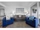 Warm and inviting living room with sofas and chairs around a stylish rug at 13427 Blue Heron Beach Dr # 1907, Orlando, FL 32821