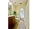 Well-maintained bathroom with a vanity and a shower, offering a view into the adjacent bedroom at 1474 Lake Side Ave, Davenport, FL 33837