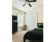 Comfortable bedroom featuring plush carpeting, a ceiling fan, and ample closet space at 1474 Lake Side Ave, Davenport, FL 33837