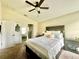 Relaxing bedroom with a plush bed, coordinated decor, and a ceiling fan at 1474 Lake Side Ave, Davenport, FL 33837