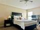 Comfortable bedroom with a ceiling fan, a neutral color scheme, and ample natural light at 1474 Lake Side Ave, Davenport, FL 33837