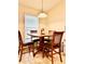 Cozy dining area with natural light and seating for four people at 1474 Lake Side Ave, Davenport, FL 33837