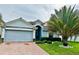 Charming single-story home with a two-car garage and well-manicured front yard at 1474 Lake Side Ave, Davenport, FL 33837