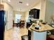 Eat in kitchen features black appliances and granite countertops at 1474 Lake Side Ave, Davenport, FL 33837