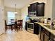 Eat-in kitchen featuring stainless steel appliances and granite countertops at 1474 Lake Side Ave, Davenport, FL 33837