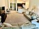 Open concept living room with lots of seating, adjacent to kitchen, perfect for entertaining at 1474 Lake Side Ave, Davenport, FL 33837
