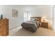 Simple bedroom featuring carpeted floors, a queen sized bed, and a window with blinds at 149 Emeraldview Ave, Davenport, FL 33897