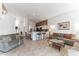 Spacious living area with open floor plan, tile flooring, neutral walls, and easy access to the kitchen at 149 Emeraldview Ave, Davenport, FL 33897