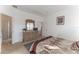 Serene main bedroom featuring carpeted floors, neutral decor, and an ensuite bathroom at 149 Emeraldview Ave, Davenport, FL 33897