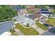 Aerial view of the single-story home, featuring well-maintained landscaping, a driveway, and a two-car garage at 171 Seabreeze Cir, Kissimmee, FL 34743