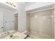 Clean bathroom featuring a tiled shower-tub combo and a vanity with a sink at 171 Seabreeze Cir, Kissimmee, FL 34743