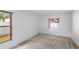 Bedroom featuring carpet and natural light from windows with views of the landscape at 171 Seabreeze Cir, Kissimmee, FL 34743