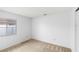 A bright bedroom featuring neutral carpet and a window providing natural light at 171 Seabreeze Cir, Kissimmee, FL 34743