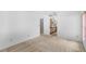 Spacious bedroom with neutral carpet and access to ensuite bathroom with lots of counter space at 171 Seabreeze Cir, Kissimmee, FL 34743